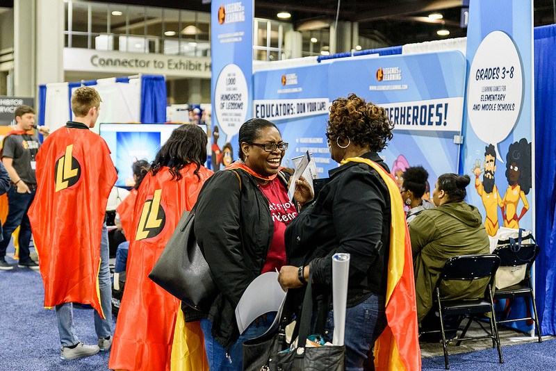 Chatting at the Legends of Learning Booth