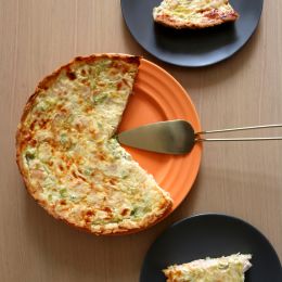 circular quiche food with 1/3 slice missing on 3 different plates